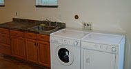 Custom basement conversion. Dirt to habitable. Custom laundry station, stained and sealed concrete floor, new windows.